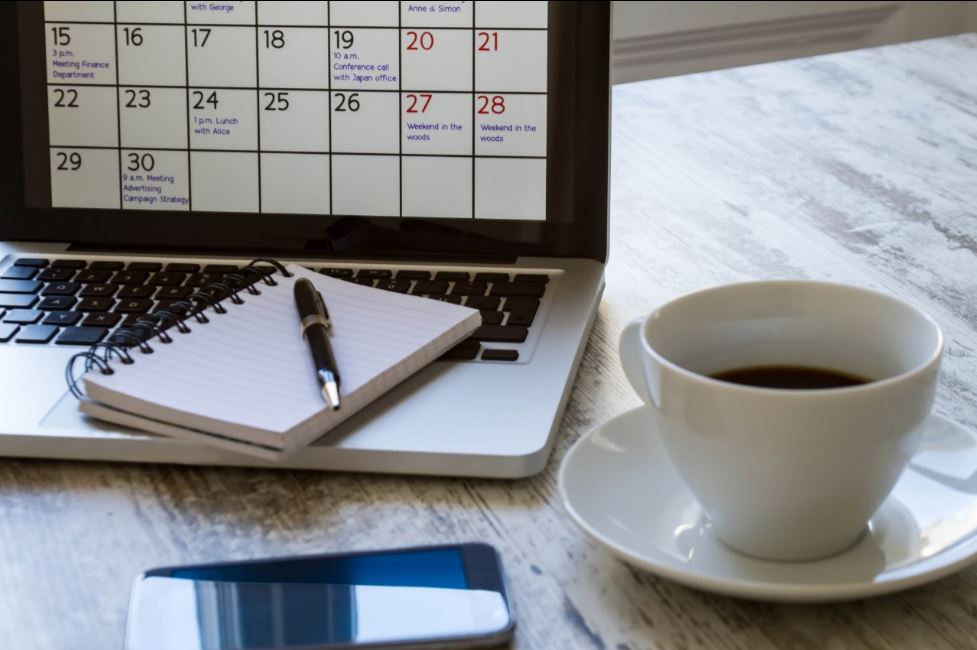 Computer with calendar on screen.