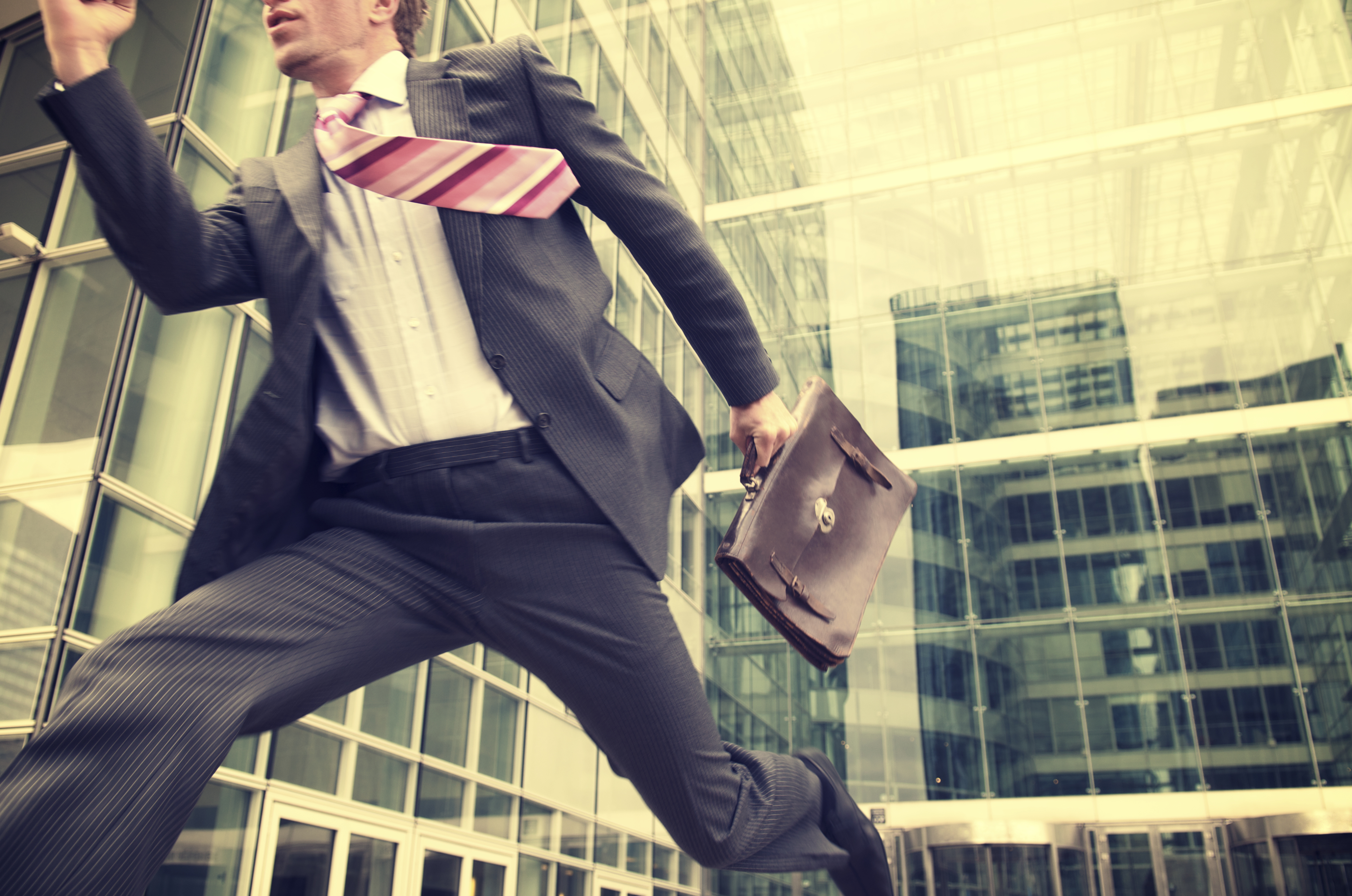 businessman running late in the city.