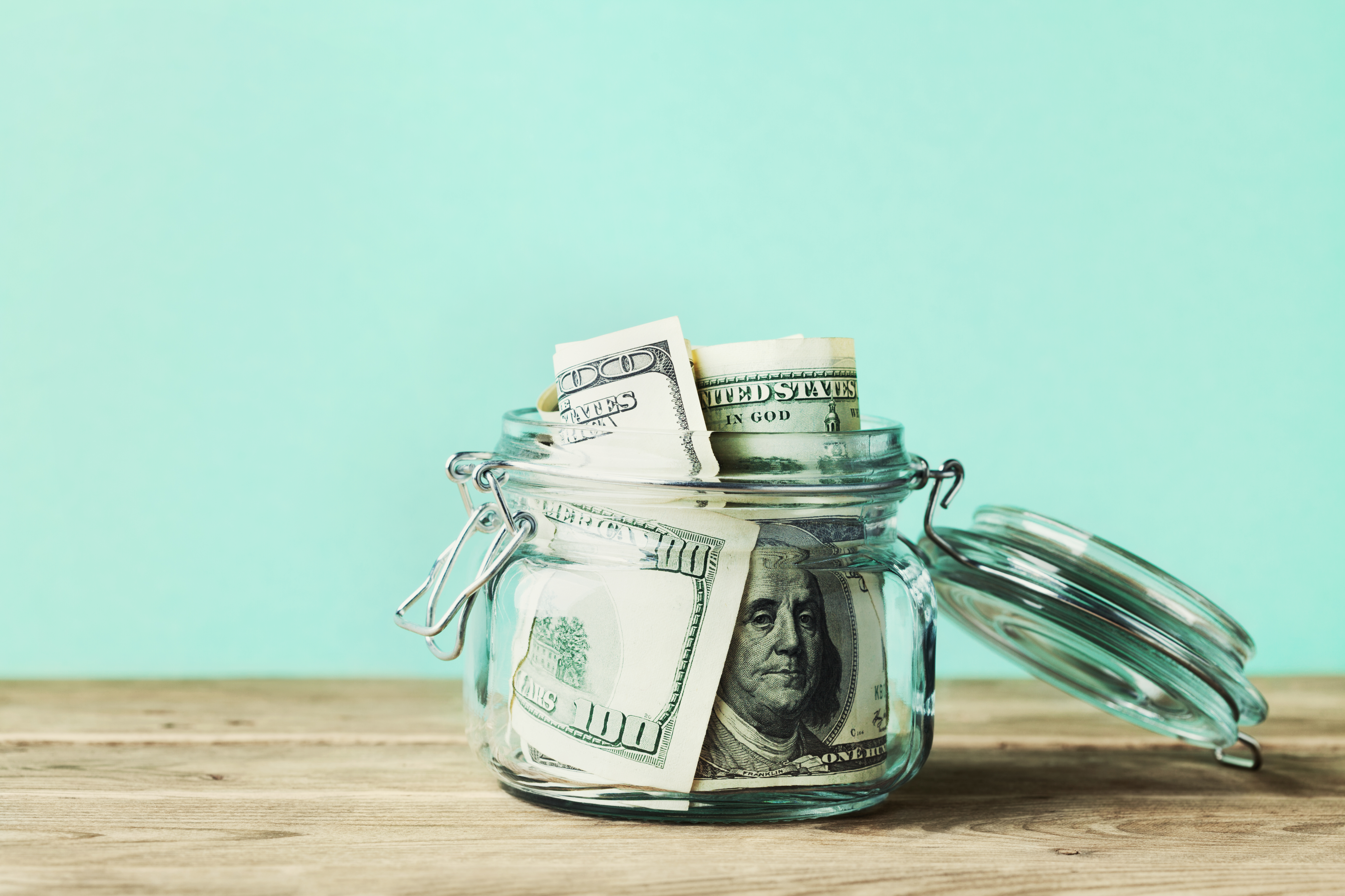 Money jar with bills