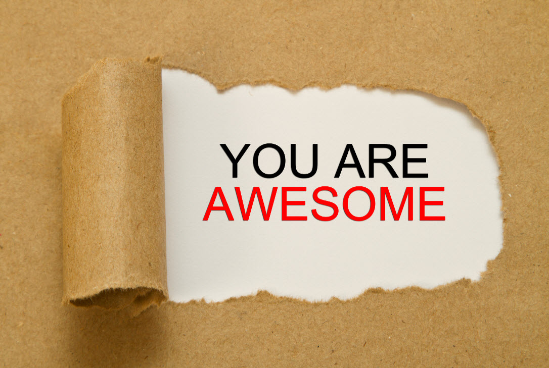 You are awesome words revealed under peeled away paper