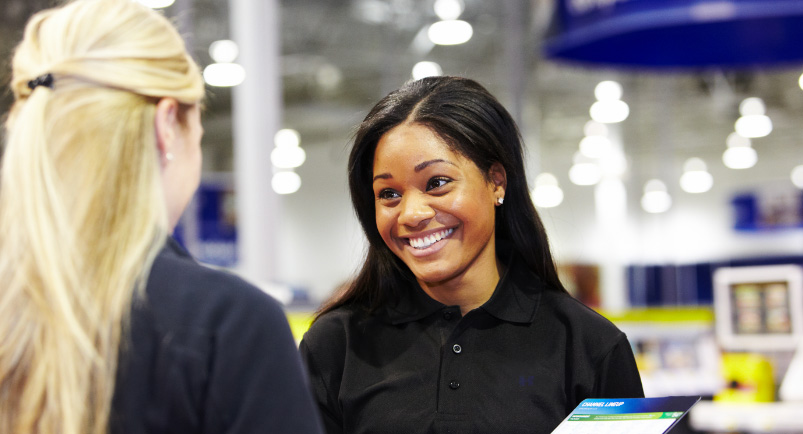 Image of two retail sales reps inside a store.